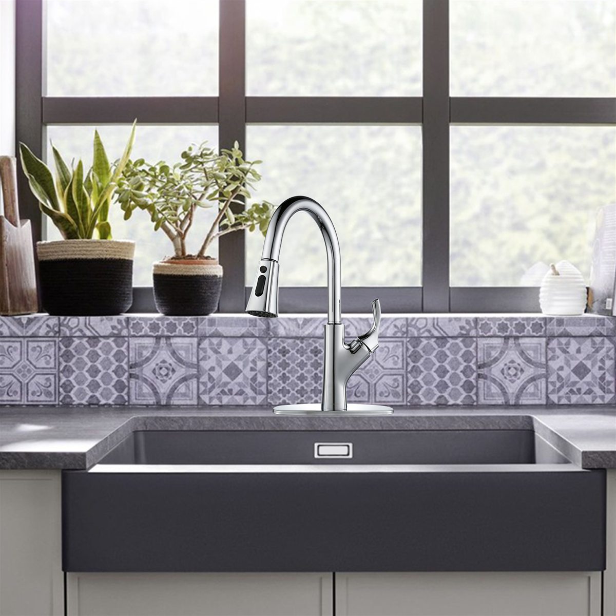 Chrome pull-down faucet over a farmhouse kitchen sink